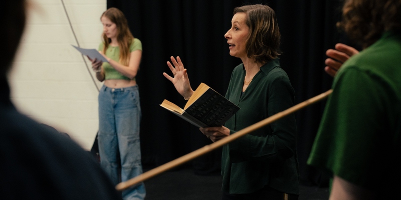 Students being led in a theatre rehearsal